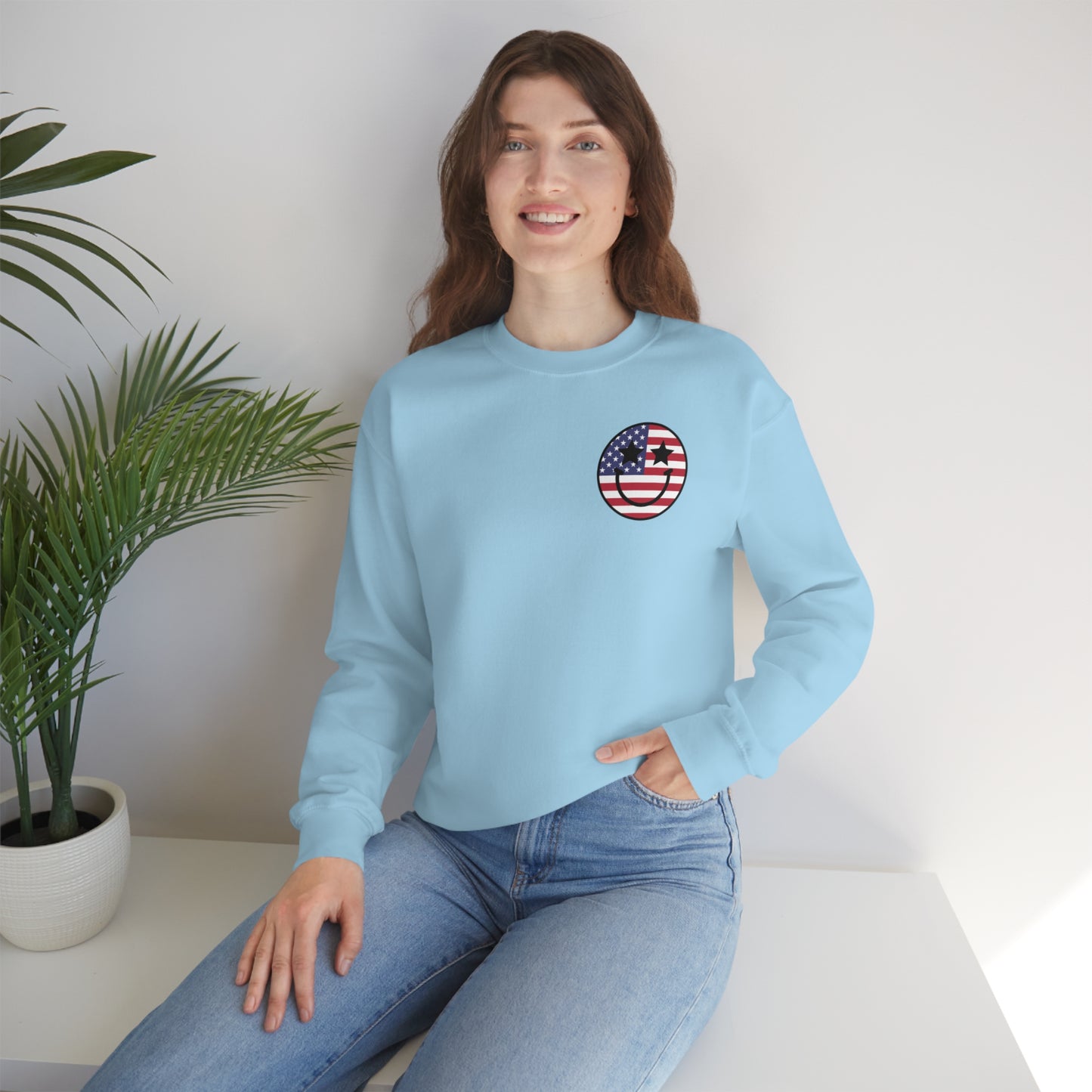 "Land of the Free Because of the Brave with Smiley Face Front" (Front & Back Design) - Unisex Heavy Blend™ Crewneck Sweatshirt