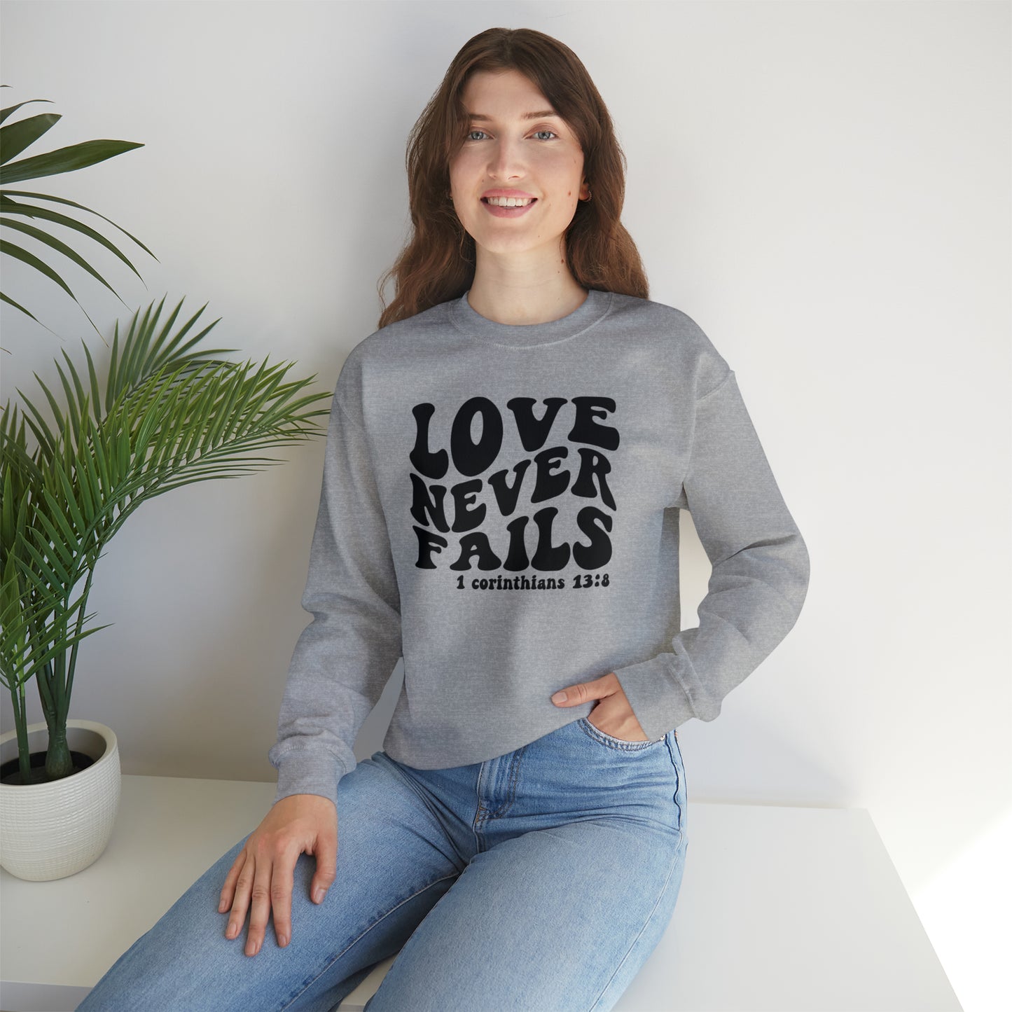 Love Never Fails Black Logo Unisex Heavy Blend™ Crewneck Sweatshirt